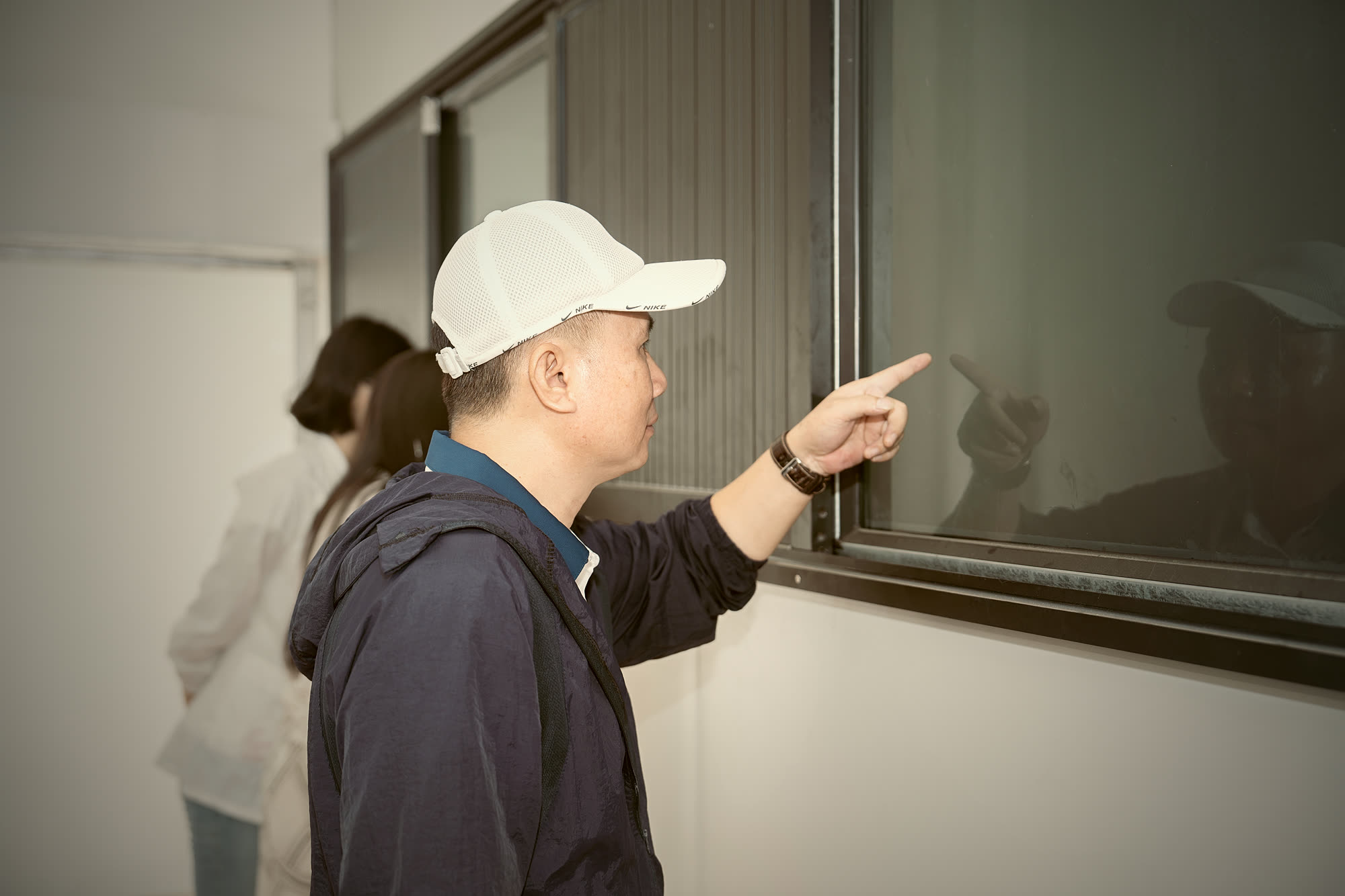 A visitor looking into the nest home at the NIS NEST Bird's Nest Cultural Hall