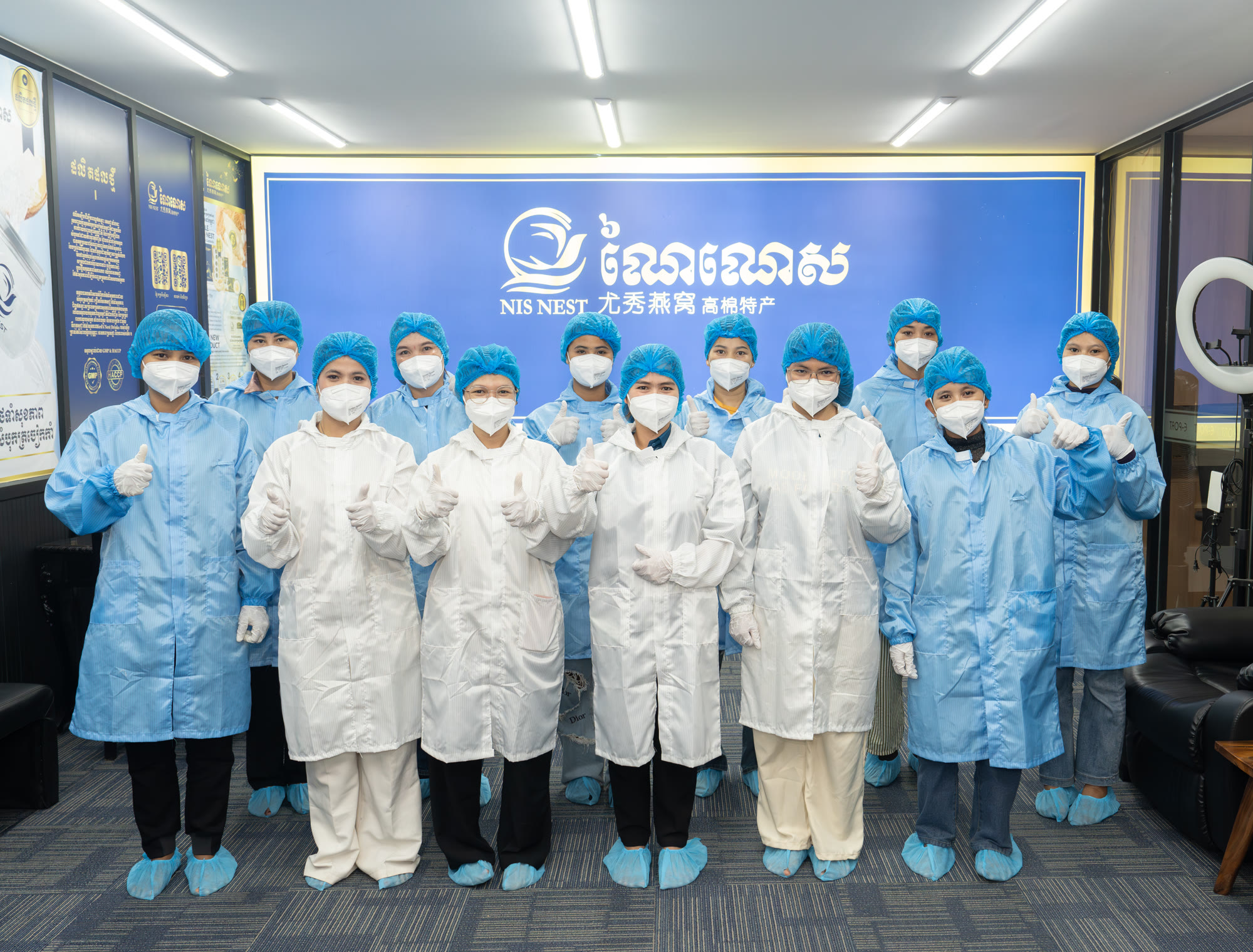 NIS NEST production team in protective clothing at the factory, Cambodia